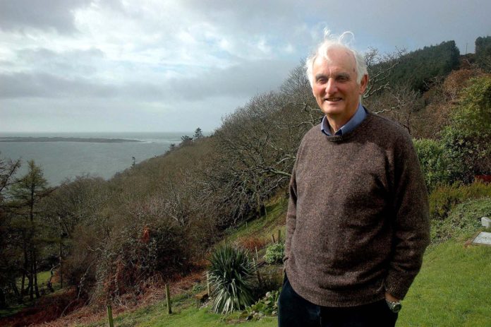 1) Sir John Houghton in the garden of his home at Aberdyfi overlooking the Dyfi Estuary.